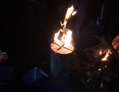 A burning log, where the fire is in the centre because there are two perpendicular saw cuts running down the tank like a cross.